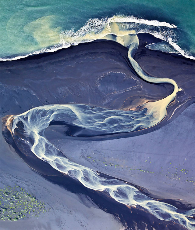 This is actually a photo of an Icelandic river - not just an optical illusion.